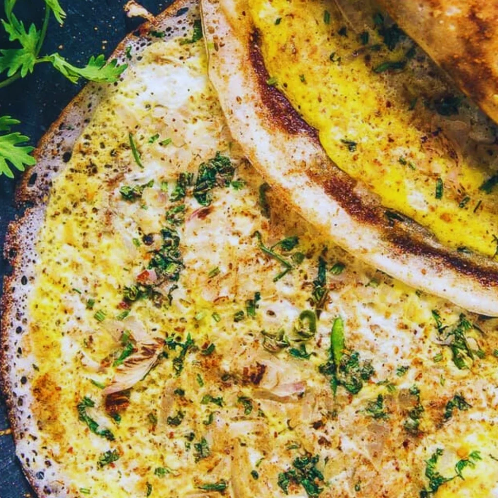 "Creamy garlic butter sauce with fresh herbs and seared chicken in a rustic skillet"