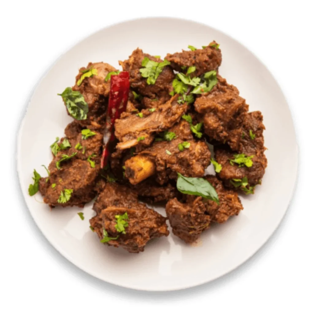 "Spicy Andhra-style chicken fry garnished with curry leaves and red chili"